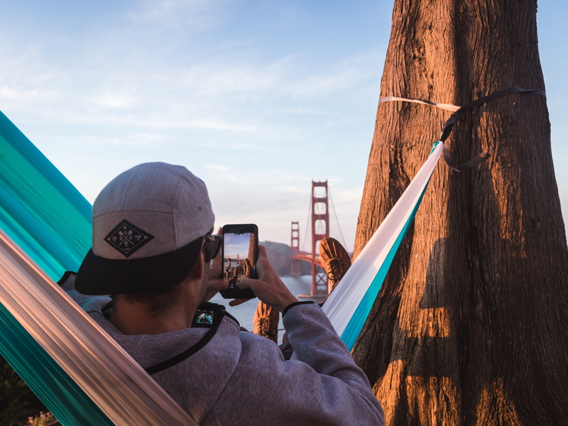 man, portrait, focus, wireless technology, activity, photo, san francisco, communication, leisure activity, bridge, swinging, smart phone, francisco, boy