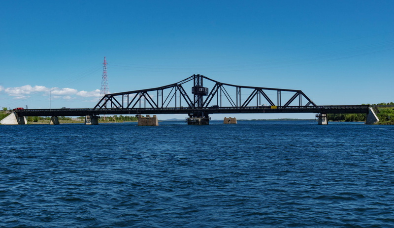 sea, waterfront, construction equipment, machinery, connection, little current, blue, bridge, water, day, copy space, built structure, bridge - man made structure