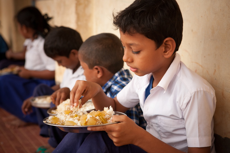 food and drink, meal, men, uniform, food, sitting, pre-adolescent child, group of people, people, 5K, males, son, offspring, child, healthy food, unhealthy eating