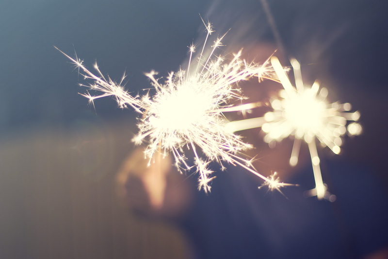 holding, person, burning, sparks, fire, arts culture and entertainment, lighted, light, event, blurred motion, focus, flame, nature, night, fireworks, long exposure