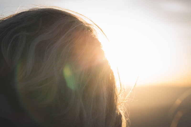 #sunspots, sunlight, person, dusk, sunset, adult, outdoors, headshot, flare, body part, red sky, lens flare, human body part, nature, reddish knob, hair