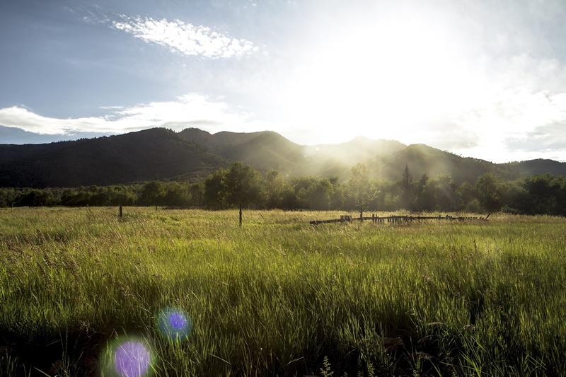 rural, tranquility, cloud - sky, agriculture, scenics - nature, plant, outdoors, land, sunbeam, no people, mountains, meadow, grass, sun, countryside, scenics