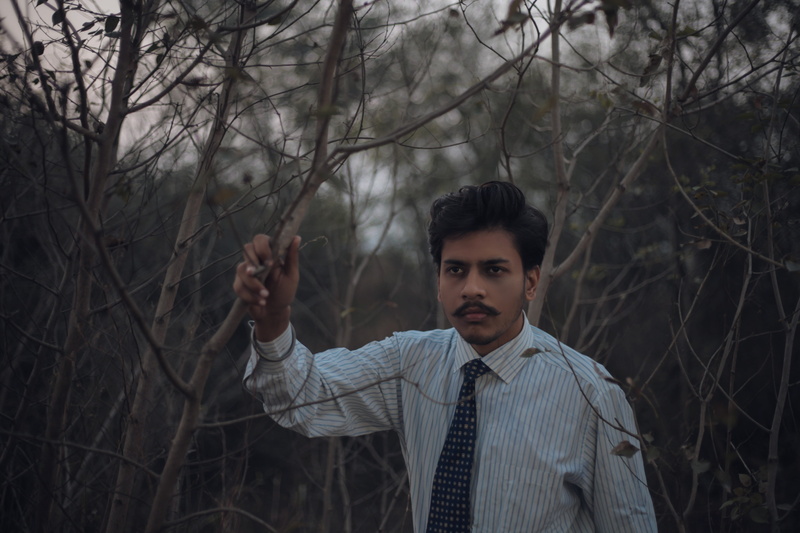 gentle, weather, one person, mystical, atmosphere, young men, real people, away, mood, tie, front view, sky, bare tree, dark, storm, dramatic, focus on foreground