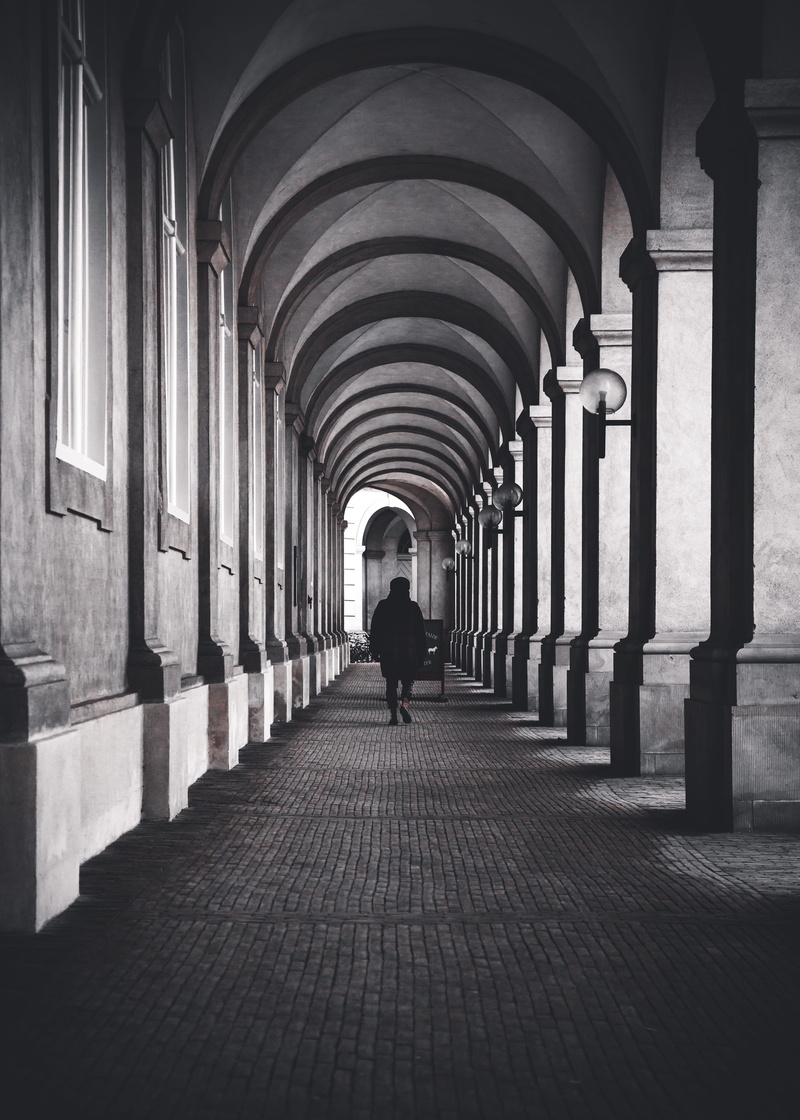 lifestyles, old, urban, arcade, architecture, christiansborg palace, arch, colonnade, rear view, city, walking, symetrical, real people, business, direction