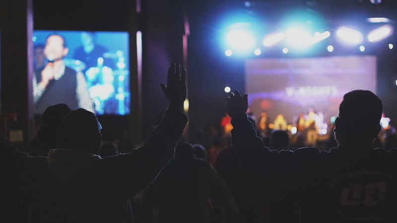 arts culture and entertainment, lighting equipment, nightlife, christian, indoors, god, worship, stage - performance space, audience, christianity, human arm