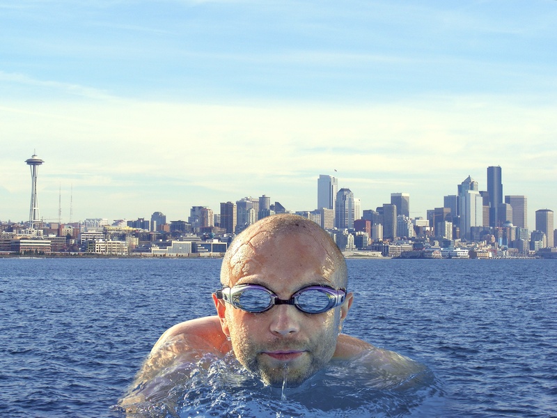 skyscraper, float, sea, swim, leisure activity, building exterior, camera, outdoors, seattle, tall - high, real people, cityscape, men, milestone, lifestyles