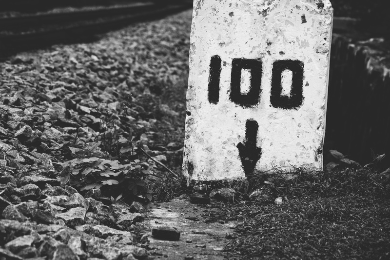 communication, information, information sign, high angle view, 100, no people, tracks, capital letter, milestone, guidance, sign, nature, down, solid, text