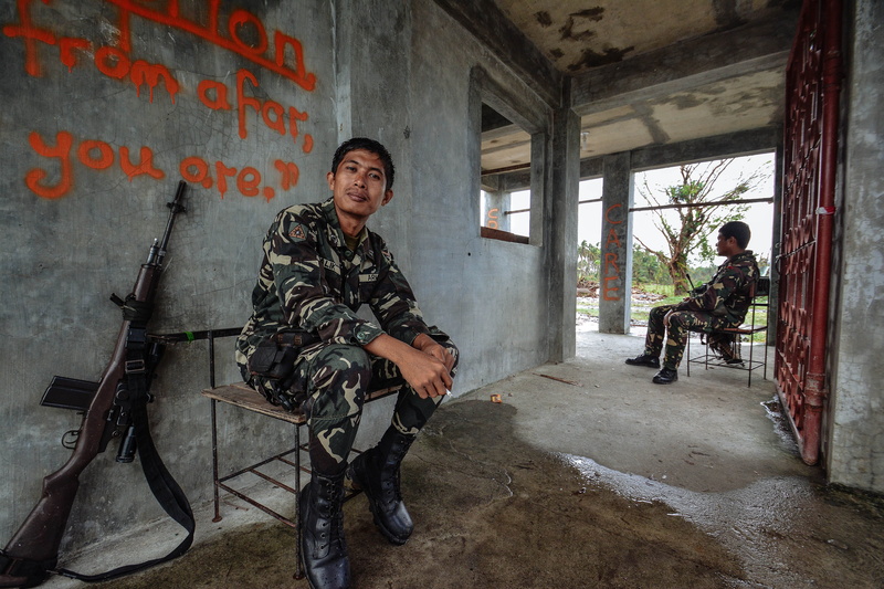 rifle, full length, mid adult men, architecture, chairs, military, government, uniform, clothing, young adult, gray, building, day, military uniform, army