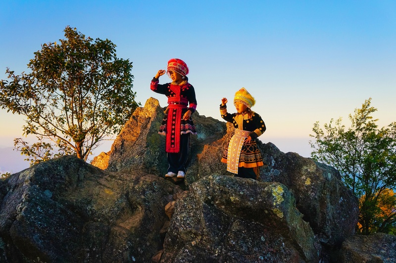 children, clear sky, two, light, hat, red, day, blue, 2K, rock, traditional, people, real people, clothing, holiday, together, two people, plant, sky
