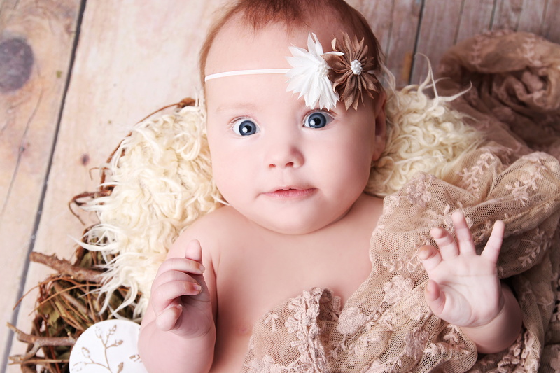 looking at camera, close-up, indoors, baby, innocence, children, 8K, hair, portrait, large beautiful blue eyes, beautiful, newborns, headband, child, one person