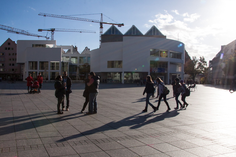 city, building, lifestyles, meier building, back light, lovers, architecture, architect, cathedral square, modern, parents with prams, day, sunlight, clouds