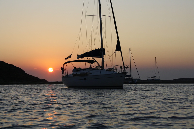 nautical vessel, mode of transportation, sunset, mast, sailboat, transportation, outdoors, anchorage, pole, no people, beauty in nature, waterfront, tranquil scene