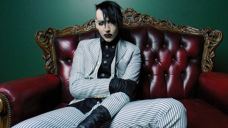 looking at camera, Makeup, striped, young adult, domestic room, relaxation, fashion, furniture, one person, Marilyn manson, Lipstick, three quarter length