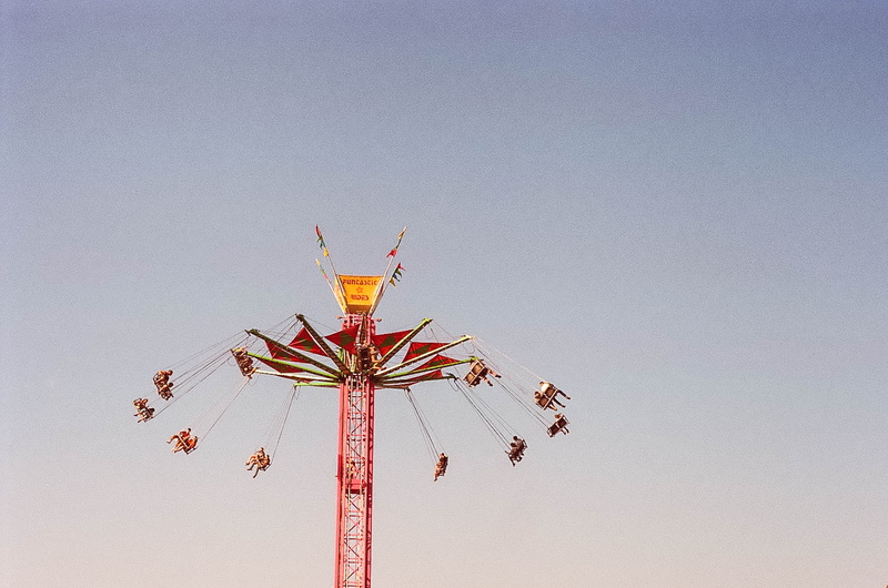 tower, daytime, gray, leisure activity, no people, low angle view, bright, chain swing ride, scenic, enjoyment, exhilaration, sky, motion, outdoors, spinning
