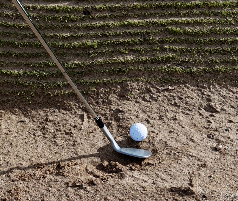 ball, sand, activity, golf club, recreation, golfing, garden hose, fairway, one person, sport, game, leisure, hand tool, trap, course, dirt, gardening equipment