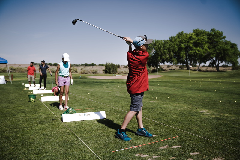 taking a shot - sport, sports equipment, outdoors, swinging, real people, field, plant, Fairway, men, golf course, leisure activity, green - golf course