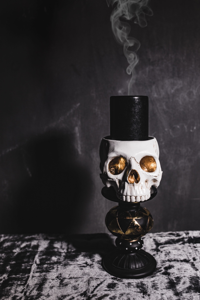metal, decorations, bone, dark, skulls, technology, close-up, autumn, scary, fall, decor, table, lighting equipment, 5K, art and craft, halloween, focus on foreground