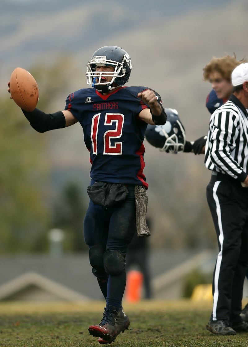 competitive Sport, american Culture, real people, boys, football team, canada, outdoors, determination, nature, american Football Uniform, quarterback