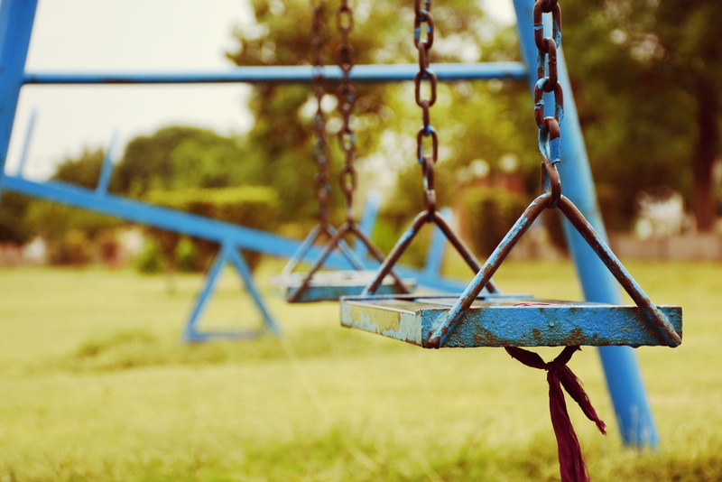 hanging, absence, park - man made space, spring, day, outdoor play equipment, framed, blue, field, nature, swing, grass, close-up, 4K, focus on foreground