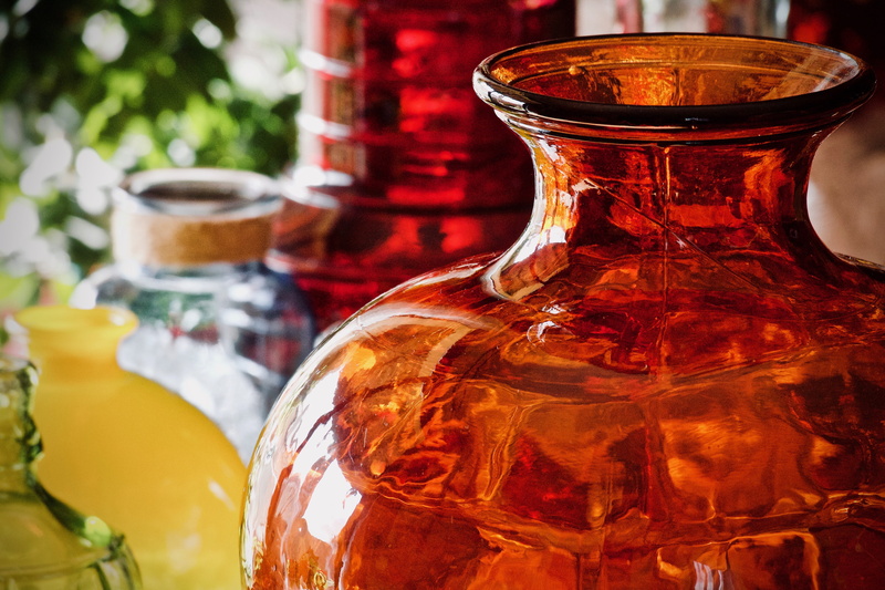 still life, focus on foreground, transparent, indoors, background, drinking glass, colored glass, empty, containers, vases, colorful, close-up, decoration