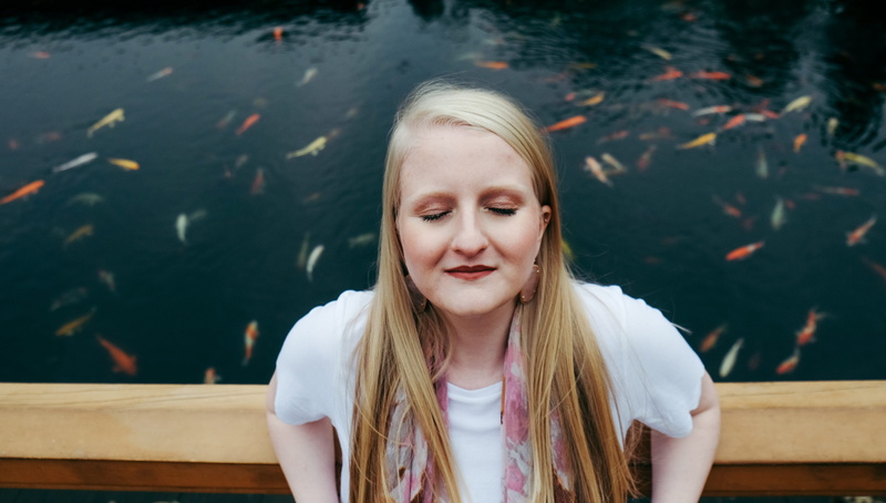 child, hairstyle, wall, nunnery, eyes shut, outdoors, vertebrate, peaceful, childhood, lifestyles, hair, front view, leisure activity, water, portrait
