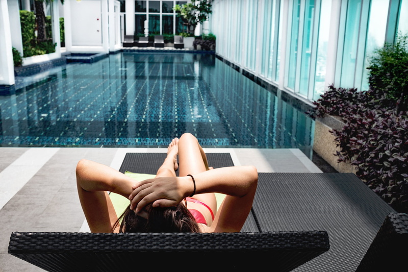 pool, lifestyles, resting, water, human body part, chaise, young adult, swimming, one Person, girl, laying, adult, lady, people, lounge, outdoors, body part