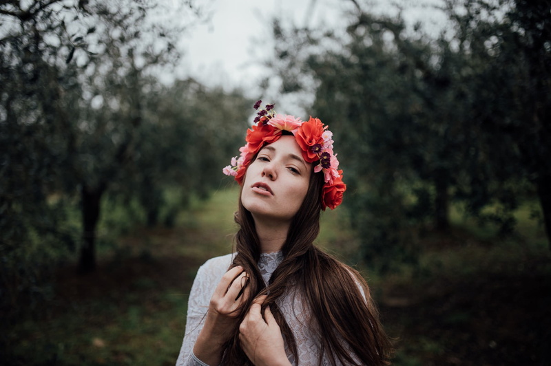 headshot, long hair, red, one person, clothing, dyed red hair, portrait, women outdoors, hair, plant, nature, focus on foreground, beautiful woman, brunette