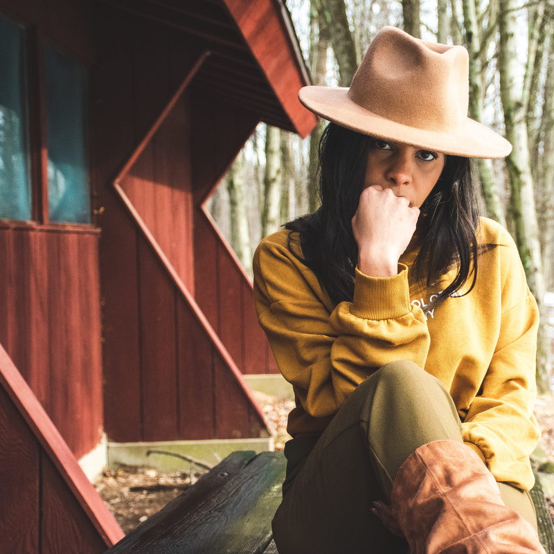 day, daylight, attractive, young adult, casual, women, human, daytime, three quarter length, winter, real people, front view, hand, hat, looking away, pretty