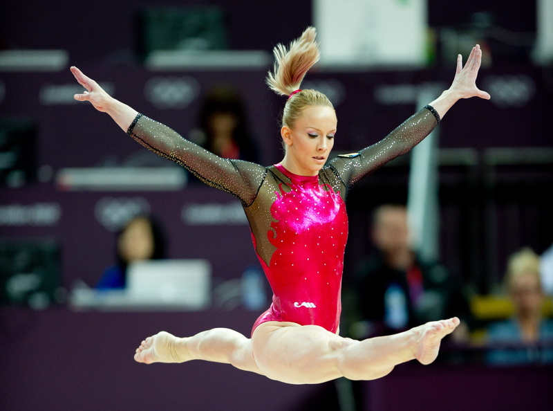 determination, skill, athlete, arms outstretched, elegance, leotard, human limb, human arm, arms raised, hair, gymnastics, performance, sport, competitive sport