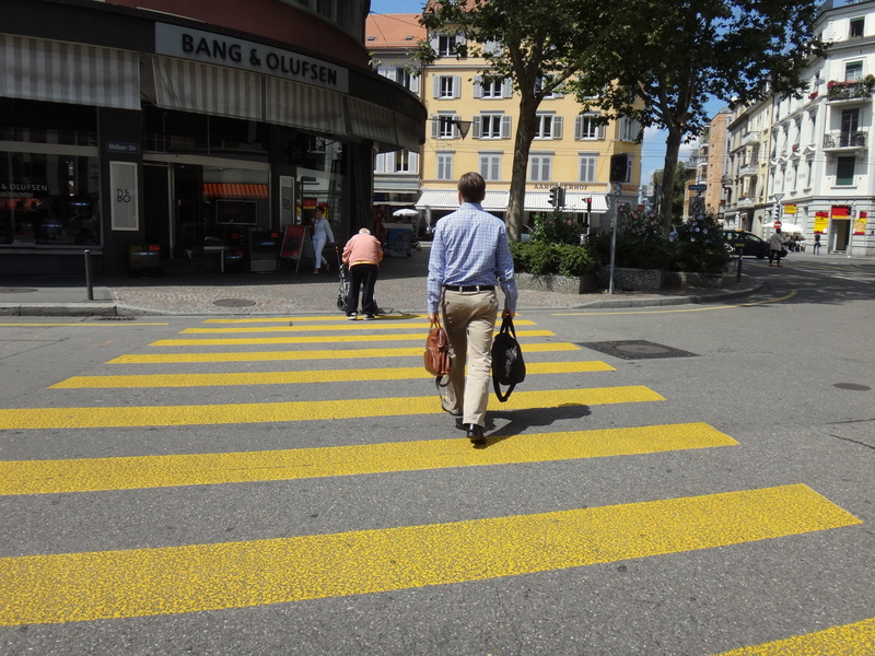 crosswalk, city Life, urban Scene, road marking, symbol, outdoors, men, color Image, people, crossing, yellow, real people, rear view, building exterior