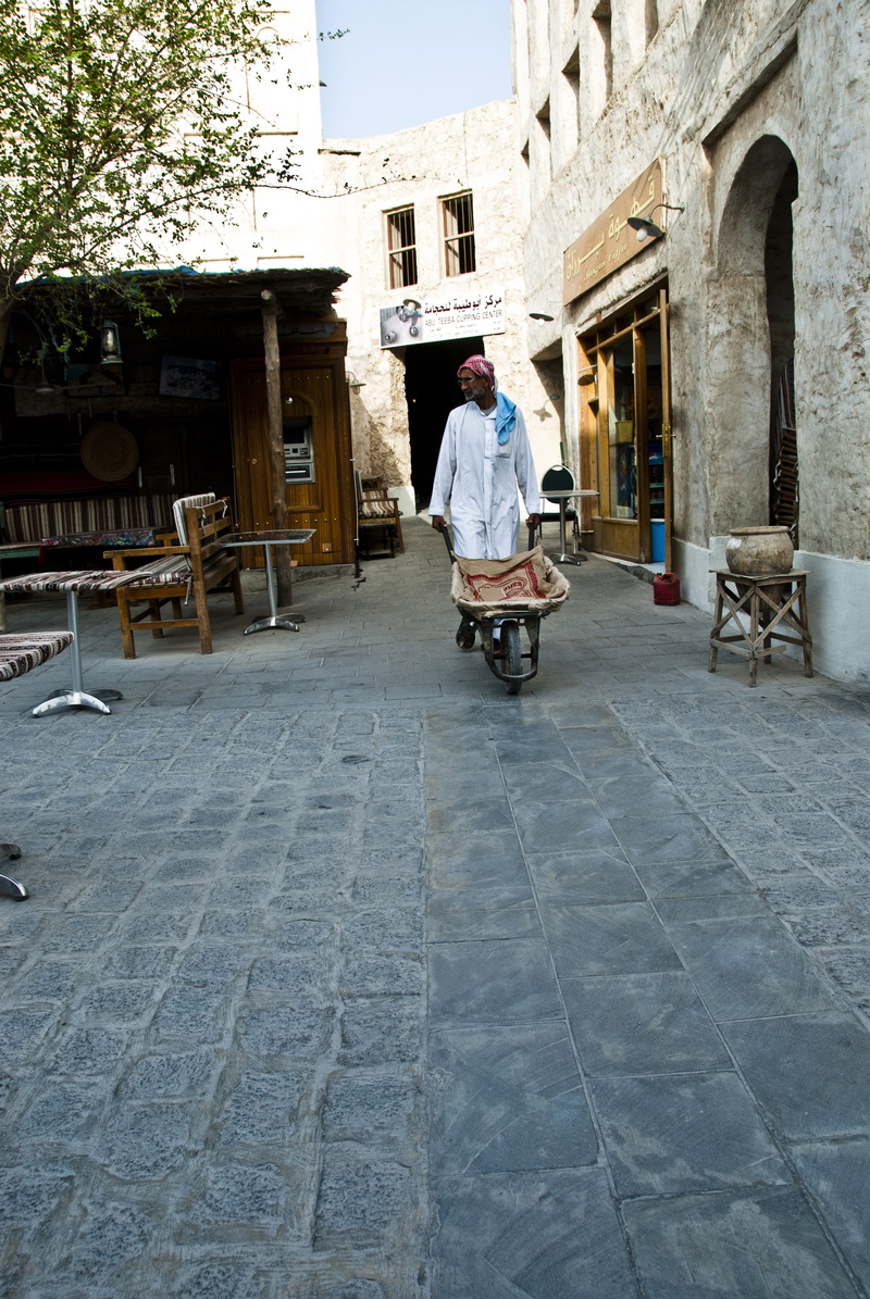 one person, photos, Alleyway, editorial, lifestyles, souq, old, color Image, wheelbarrow, footpath, paving stone, rear view, people, architecture, men