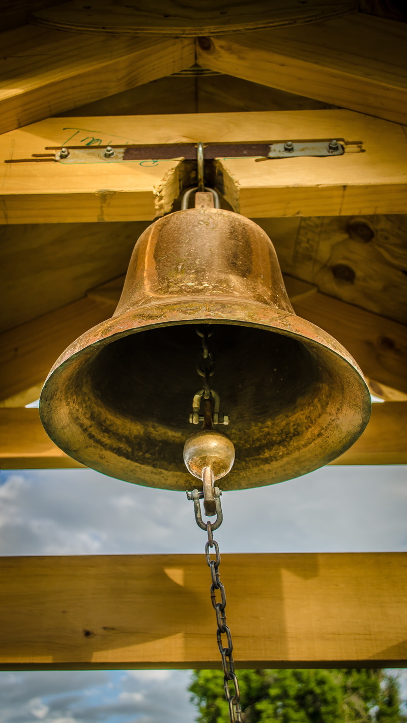 focus on foreground, church, bell, day, architecture, hanging, angle, 4K, retro styled, built structure, bell tower, low, school, close-up, ceiling, metal