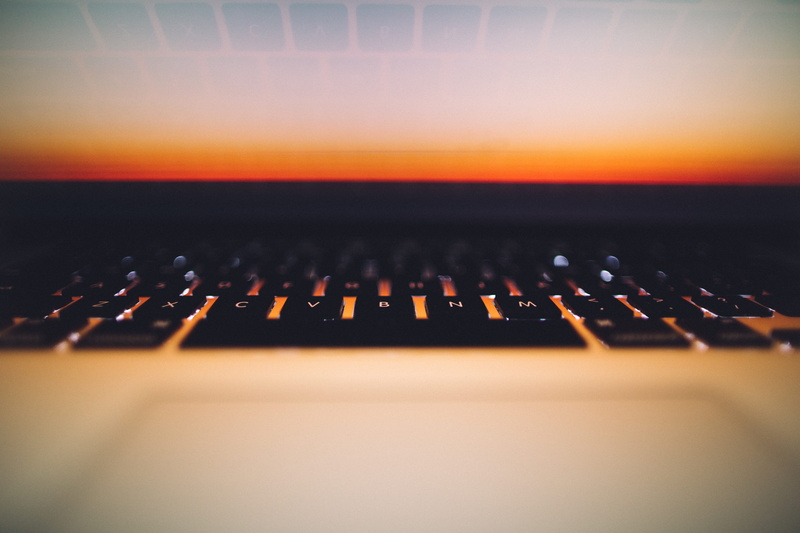 musical equipment, laptop, indoors, mbp, sound recording equipment, orange color, mac, studio, sunset, in a row, computer keyboard, arts culture and entertainment