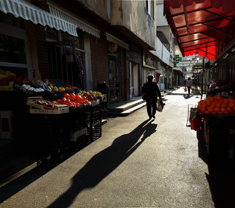 architecture, shadow, couch, full length, human, day, walkway, awning, one person, market, city, furniture, lifestyles, photography, sidewalk, walking