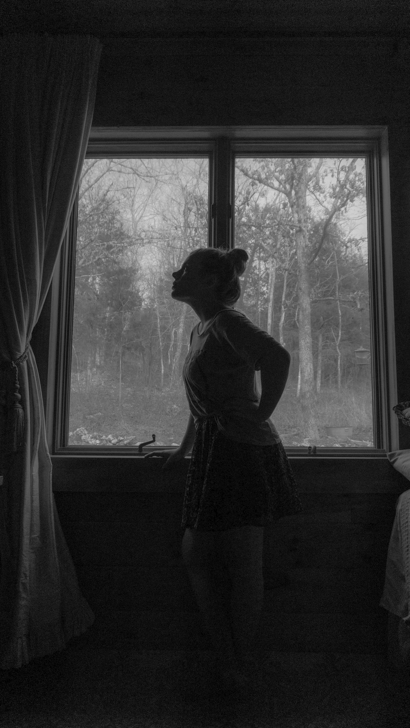three quarter length, lifestyles, 5K, women, looking, day, person, indoors, curtain, casual clothing, woman, contemplation, one person, dark, clothing