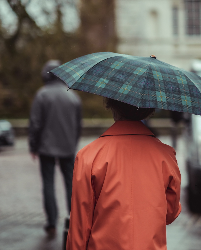 incidental people, men, city, pattern, rear view, architecture, real people, orange, outdoors, united kingdom, england, protection, walking, lifestyles