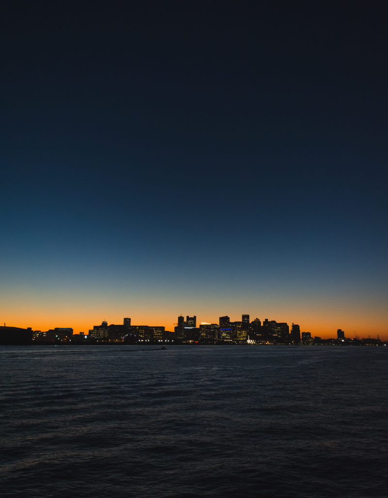 city, view into land, no people, tranquil scene, sunset, silhouette, skyline, built structure, skyscrapers, skyscraper, cityscape, building exterior, harbor