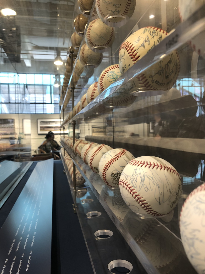 indoors, retail display, display cabinet, baseball - sport, baseballs, large group of objects, reflection, choice, store, boston, retail, united states