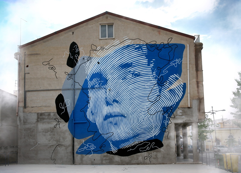 day, street art, outdoors, design, face, girl, real people, creativity, colors, nature, building exterior, graffiti, protection, wall, facade, human representation