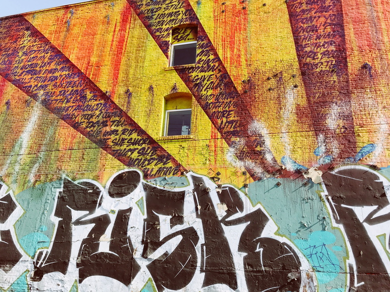 orange, graffiti, wall - building feature, paint, white, human representation, united states, built structure, yellow, windows, day, mural, green, multi colored