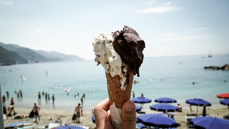 women, real people, focus on foreground, ocean, ice cream, leisure activity, food, dessert, latte, sky, daytime, nature, vehicle, icing, sand, creme, land