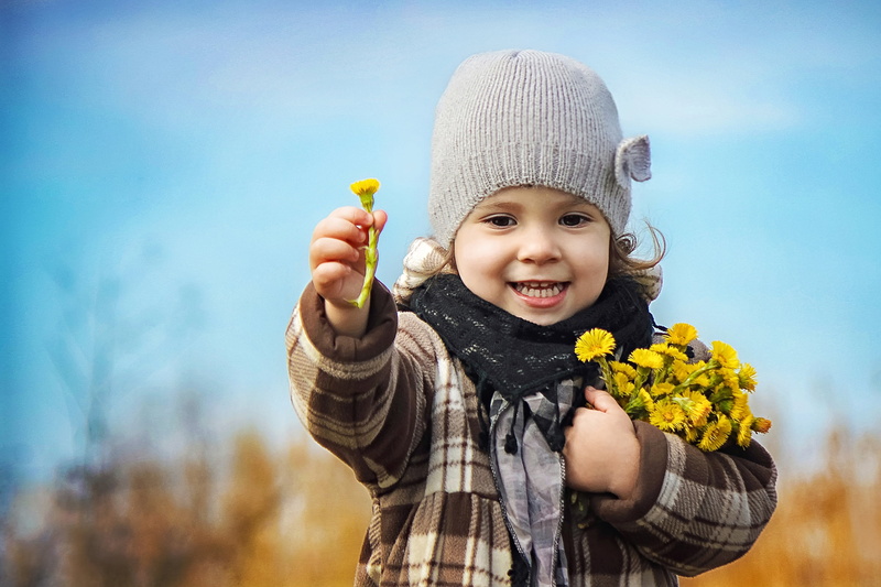happiness, females, cute, nature, lifestyles, baby, front view, looking at camera, day, gray, joy, season, beanie, childhood, girls, people, summer, child