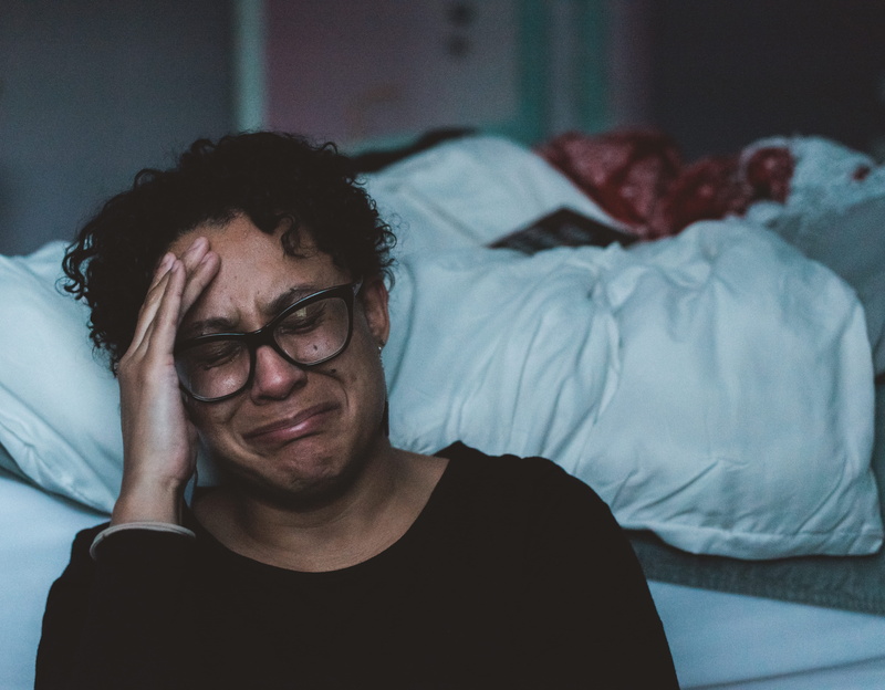 indoors, african american, bed, adult, men, man, lifestyles, holding, head, black hair, gray, portrait, eyes closed, 5K, one person, glasses, real people