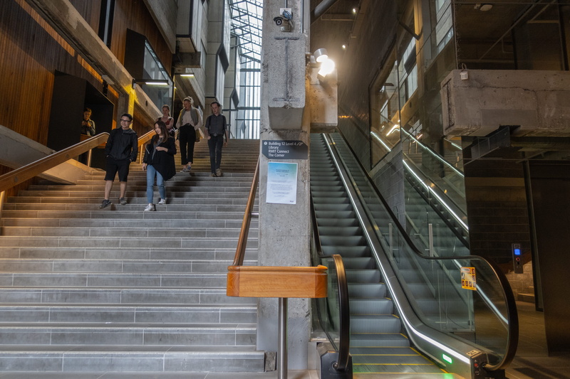 indoors, moving up, adult, escalator, building, incidental people, rmit university building 10, 5K, lifestyles, melbourne, walking, low angle view, built structure