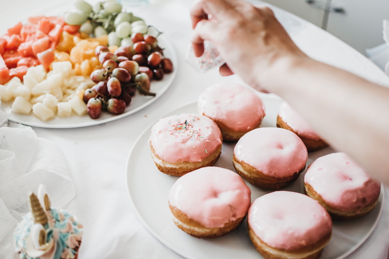 party, berliner, goody, indoors, fruit, food, high angle view, temptation, freshness, sprinkle, eat, celebration, healthy, one person, cake, close-up, unhealthy