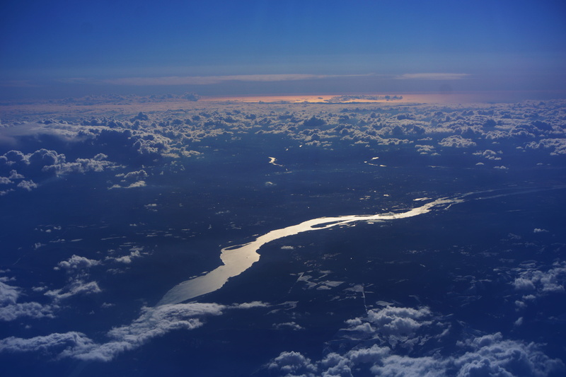 cloud, landscape, coast, non-urban scene, far away, aerial view, scenery, sky, land, horizon, shoreline, scenics - nature, day, air vehicle, view, cloud - sky