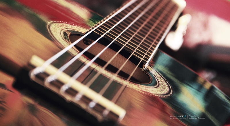 close-up, woodwind instrument, arts culture and entertainment, black, wind instrument, tilt, indoors, musical instrument string, rock music, guitar, fretboard