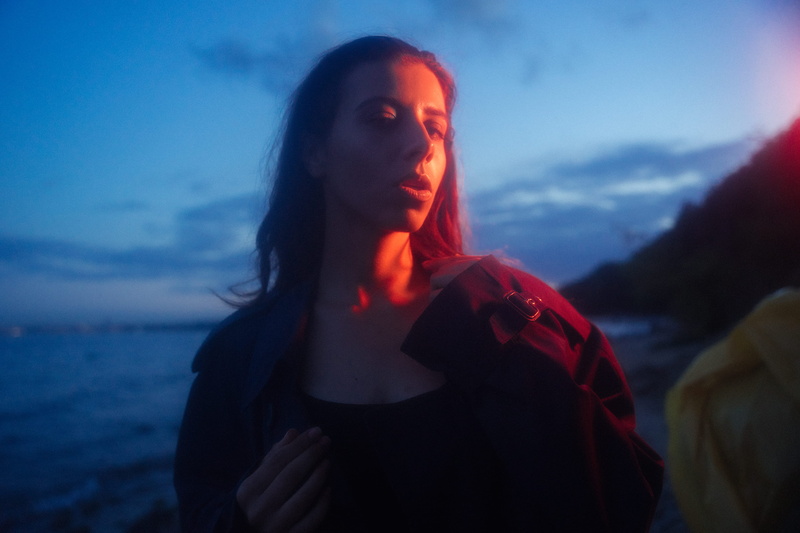 cloud - sky, plastic, cloud, adult, cape, sun, tree, clothing, lip, navy, scarf, face, blue, waist up, one person, outdoors, eye, awesome, headshot, beach