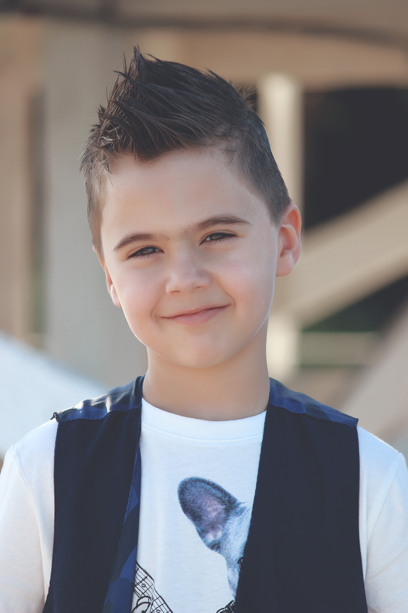 child, black, outdoors, vest, lifestyle, cute, lovely, boys, day, 5K, headshot, smiling, shirt, one person, lifestyles, innocence, adorable, front view
