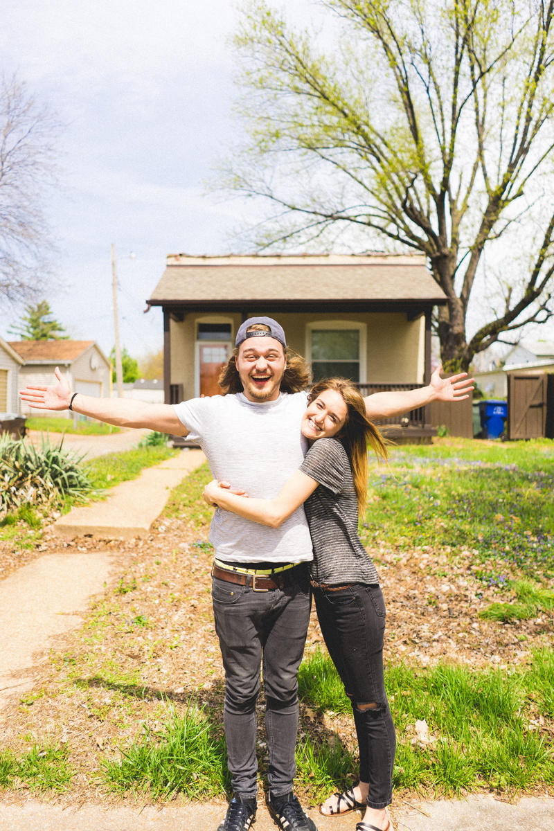 front view, couple, city, hug, adult, building exterior, tree, two people, first house, smiling, portrait, couple - relationship, real people, outdoors